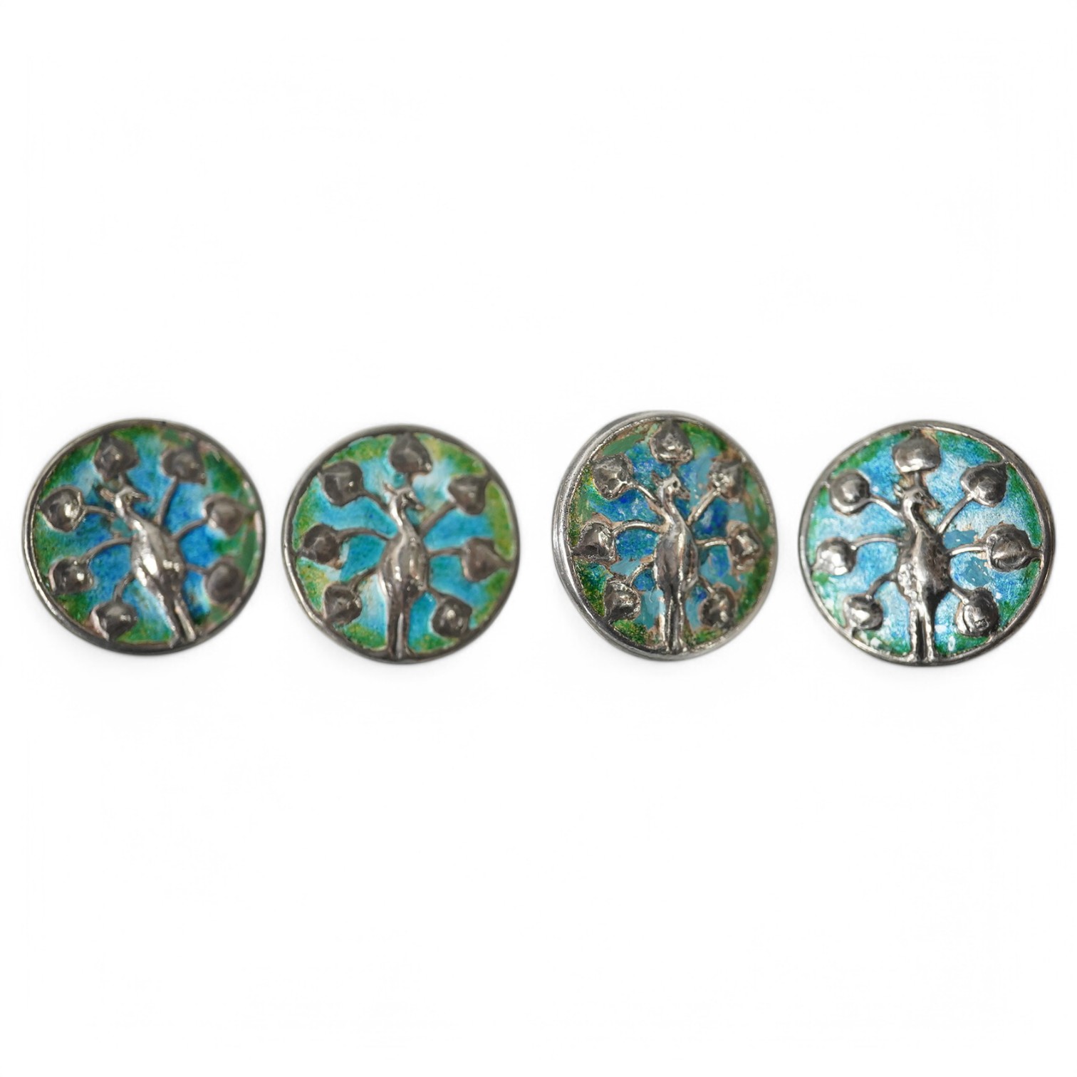 A set of 4 Liberty & Co Cymric enamelled silver buttons, decorated with peacocks, Birmingham 1901, 26mm, Condition - good